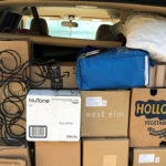 Picture of moving boxes in the back of a minivan