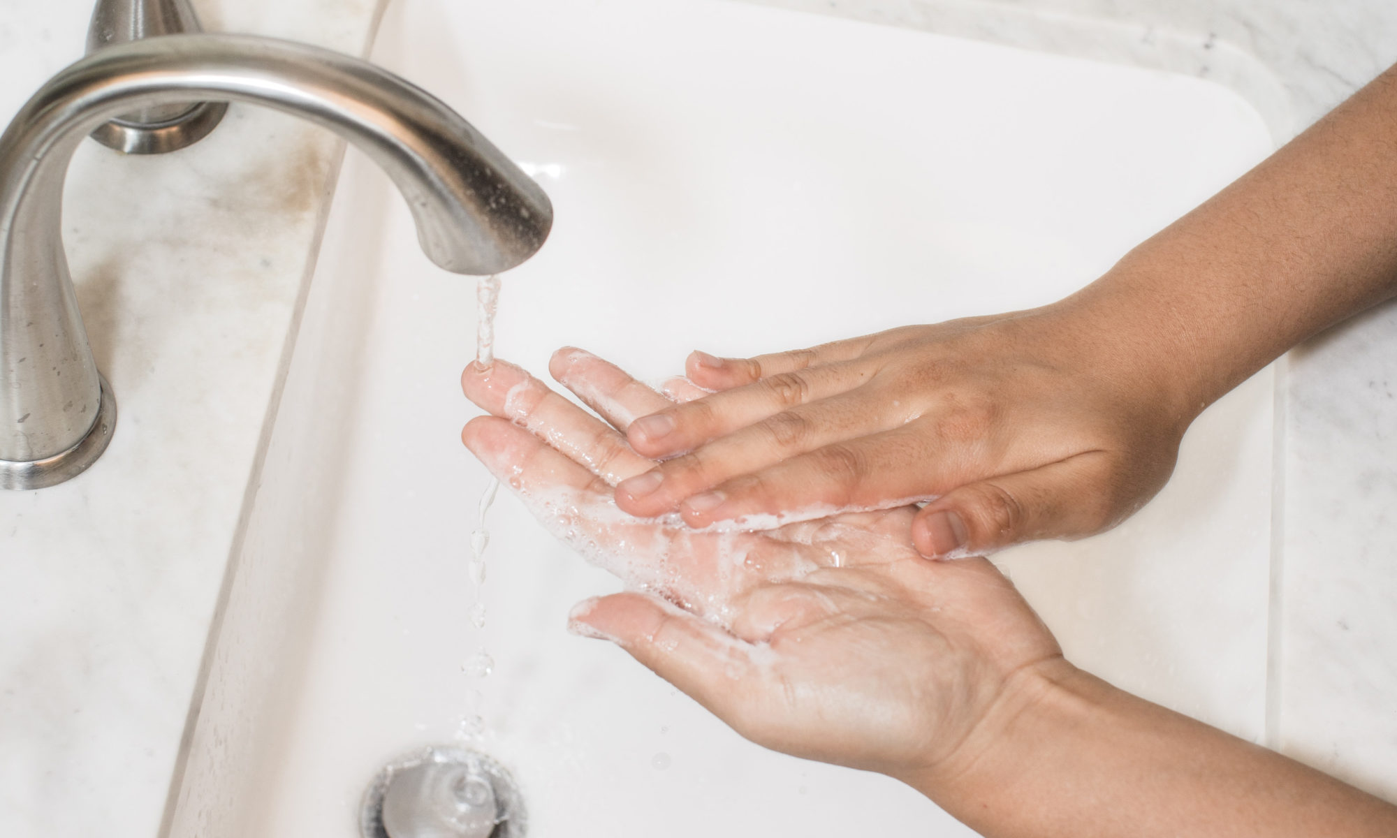 Picture of someone washing their hands