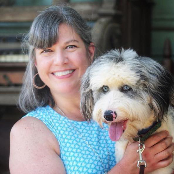 Picture of Karen Armsey holding a dog