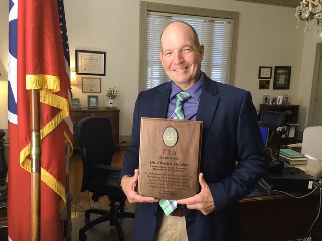 Picture of Charlie Hatcher with his award