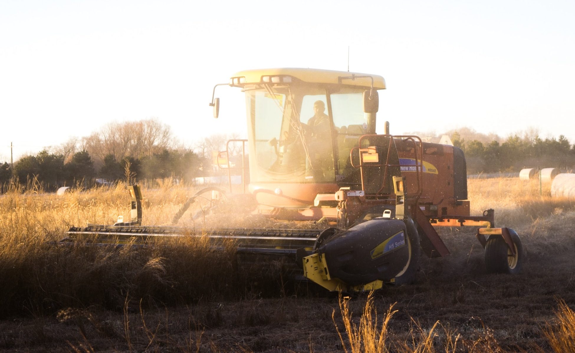 Picture of tractor with a sunset background