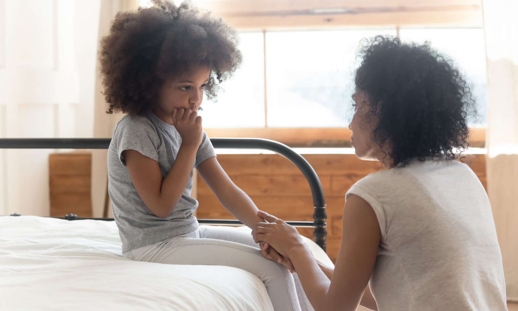 Woman talking to young girl