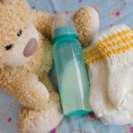 Image of teddy bear with bottle of infant formula