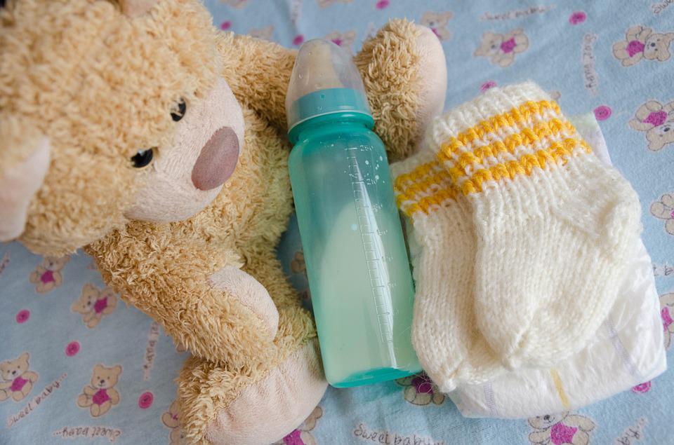 Image of teddy bear with bottle of infant formula