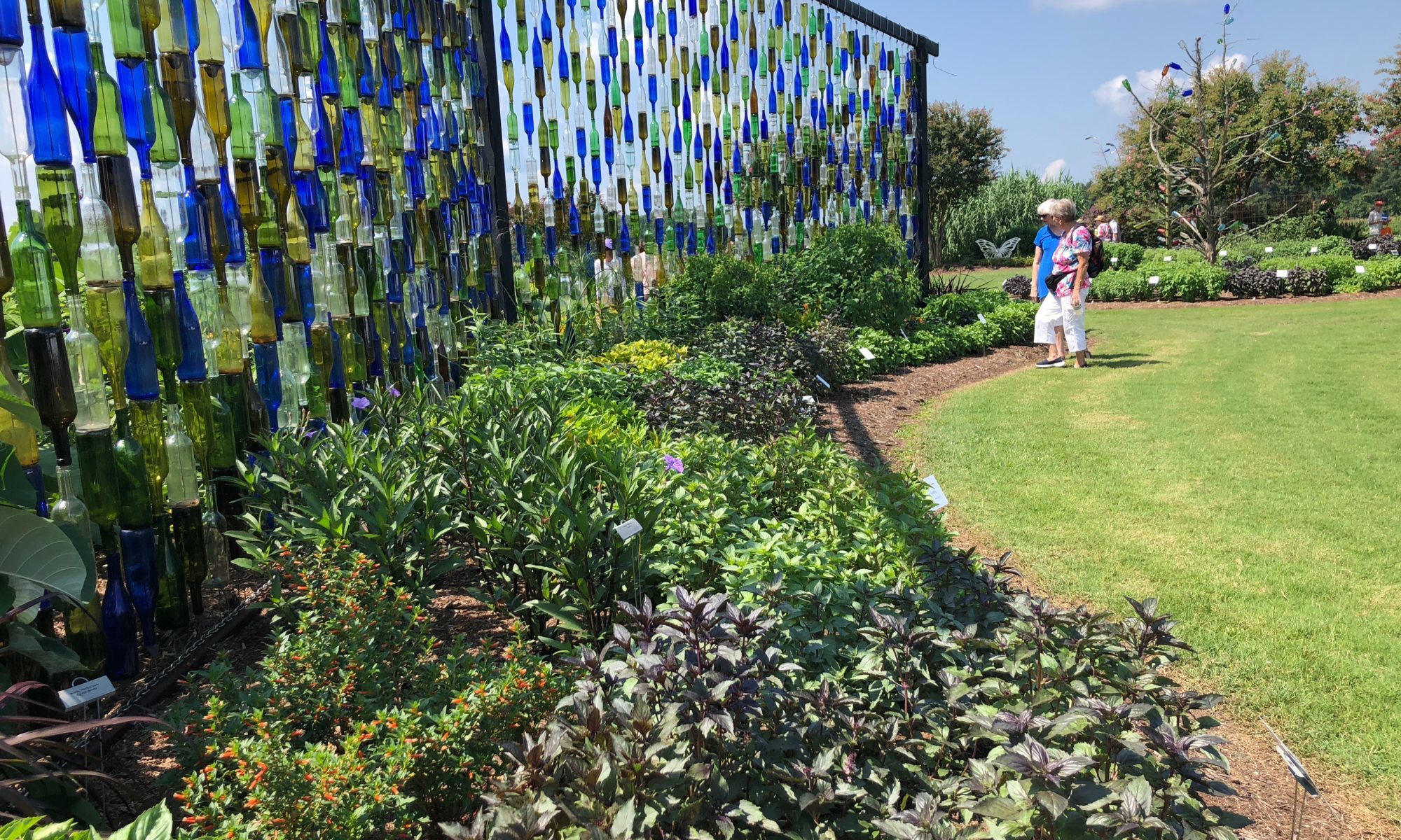 A wall of recycled wine bottles