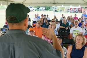 audience watching plant sale presentation