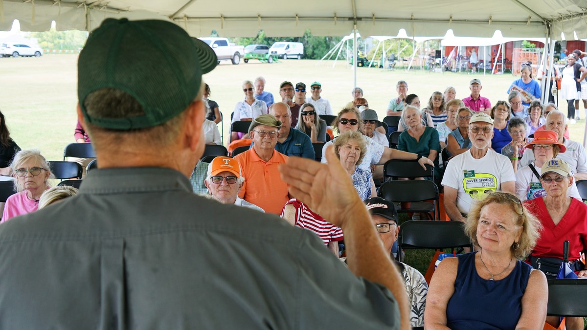 audience watching plant sale presentation