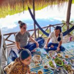 Kristen having lunch with Cambodians