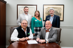 UTIA and USDA leaders pose in front of table