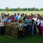 attendees gather in field at SFIREG meeting