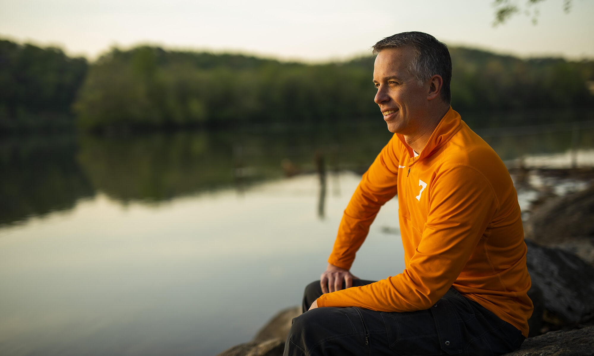 Portrait of Brad Collett sitting by the Tennessee River