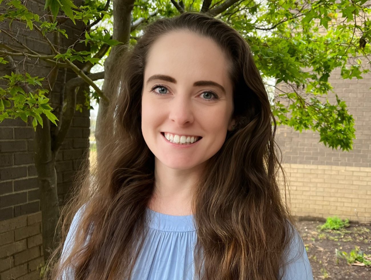 Autumn McLaughlin stands outside the West Tennessee AgResearch and Education Center.