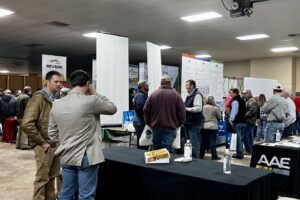 Agricultural producers and other attendees talk to vendors at the West Tennessee Grain and Soybean Producers Conference's annual trade show