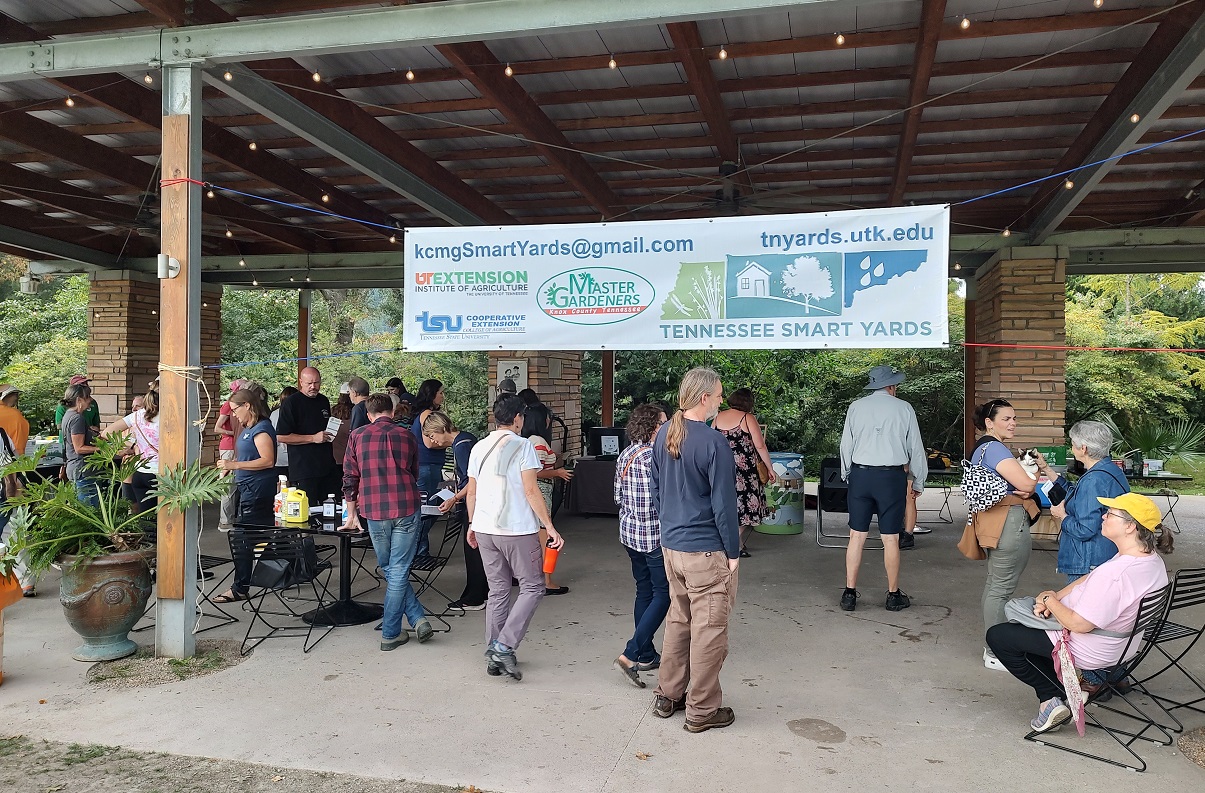 A crowd of people under a pavilion