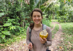 Holly Brabazon holding a cacao plant