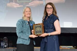 Dana Porter, professor with Texas A&M and president of ASABE (2023-2024), presenting an award to Lori Duncan