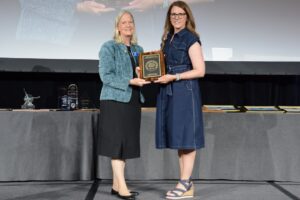 Dana Porter, professor with Texas A&M and president of ASABE (2023-2024), presenting an award to Lori Duncan