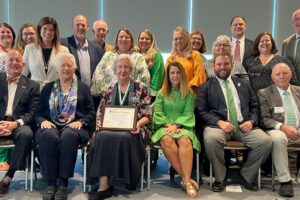 Ruth Henderson McQueen seated in the middle of the the Tennessee Delegation at the 2024 conference of the National Association of Extension 4-H Youth Development Professionals