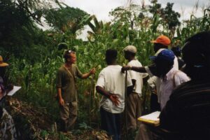 Adam Willcox speaking with local hunters in Cameroon