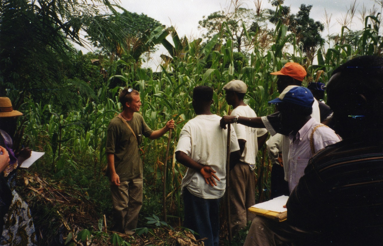 Adam Willcox speaking with local hunters in Cameroon