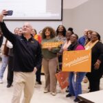 Keith Carver, senior vice chancellor and senior vice president for the UT Institute of Agriculture, takes a selfie with Genesis Nolan and others after her Torchbearer surprise.