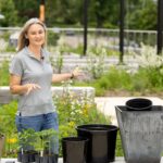 Natalie Bumgarner on a rooftop garden demonstrating how to care for container plants