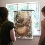 Maleah-Giles-former-NCTP-Graphic-Design-Intern with acorn illustration