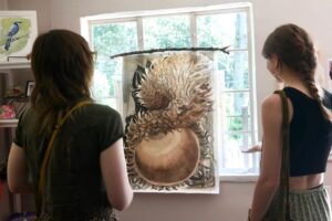 Maleah-Giles-former-NCTP-Graphic-Design-Intern with acorn illustration