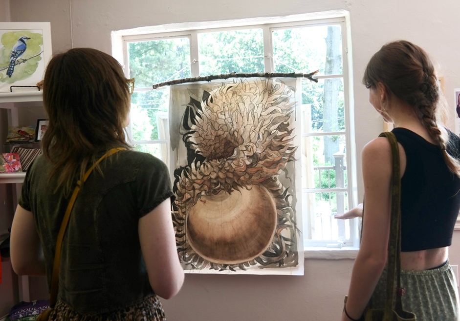 Maleah-Giles-former-NCTP-Graphic-Design-Intern with acorn illustration