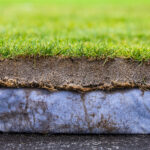 composite layers of a natural grass playing surface