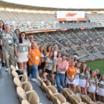 Group of people standing on the bleachers in Neyland Stadium.