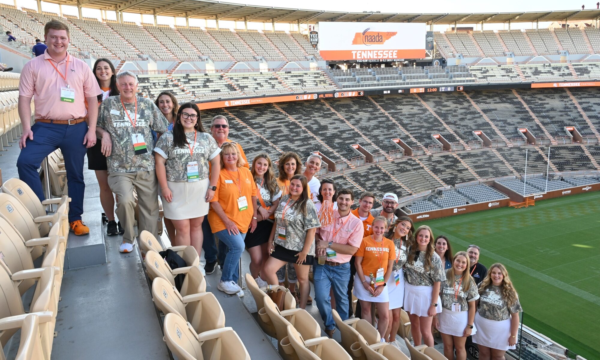 Group of people standing on the bleachers in Neyland Stadium.