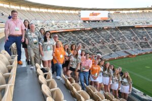 Group of people standing on the bleachers in Neyland Stadium.