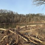 Flood devastation next to a river.