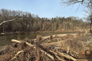 Flood devastation next to a river.