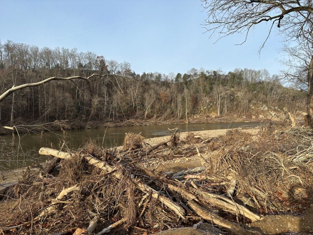 Flood devastation next to a river.