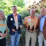 Keith Carver poses with the award winners.