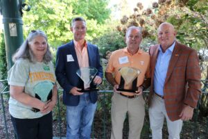 Keith Carver poses with the award winners.